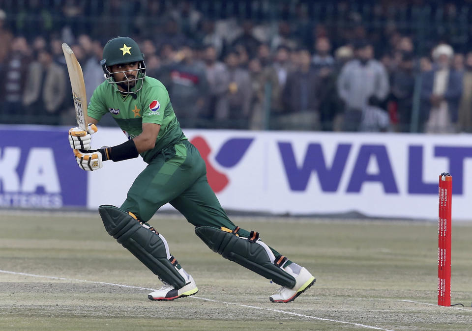 Pakistan batsman Babar Azam follows the ball after playing a shot during the second T20 cricket match against Bangladesh at Gaddafi stadium, in Lahore, Pakistan, Saturday, Jan. 25, 2020. (AP Photo/K.M. Chaudary)