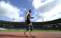 Oscar Pistorius of South Africa walks off the track during a training session, ahead the upcoming Memorial Van Damme, IAAF Diamond League athletics meet, at the King Bauduin stadium in Brussels September 13, 2011. REUTERS/Laurent Dubrule (BELGIUM - Tags: SPORT ATHLETICS TPX IMAGES OF THE DAY) - RTR2R8FV