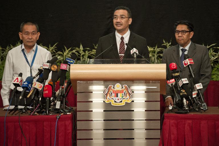 Malaysia's Transport Minister Hishammuddin Hussein (centre) answers questions during a press conference in Kuala Lumpur, on March 24, 2014