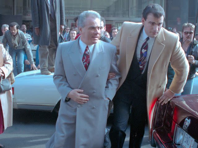 <p>Bettmann</p> John Gotti outside of the court during his assault trial in 1990.