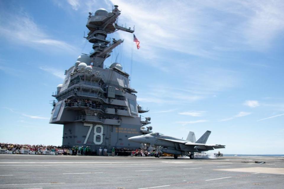 Sailors and their families and friends observe the USS Gerald R. Ford’s (CVN 78) 10,000th recovery from the flight deck, June 25, 2022