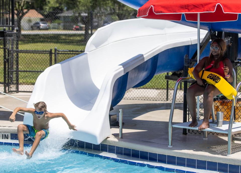 Lifeguard Devyn Waters keeps an eye on swimmers on June 28 at the Jervey Gantt Aquatic Fun Center in Ocala.