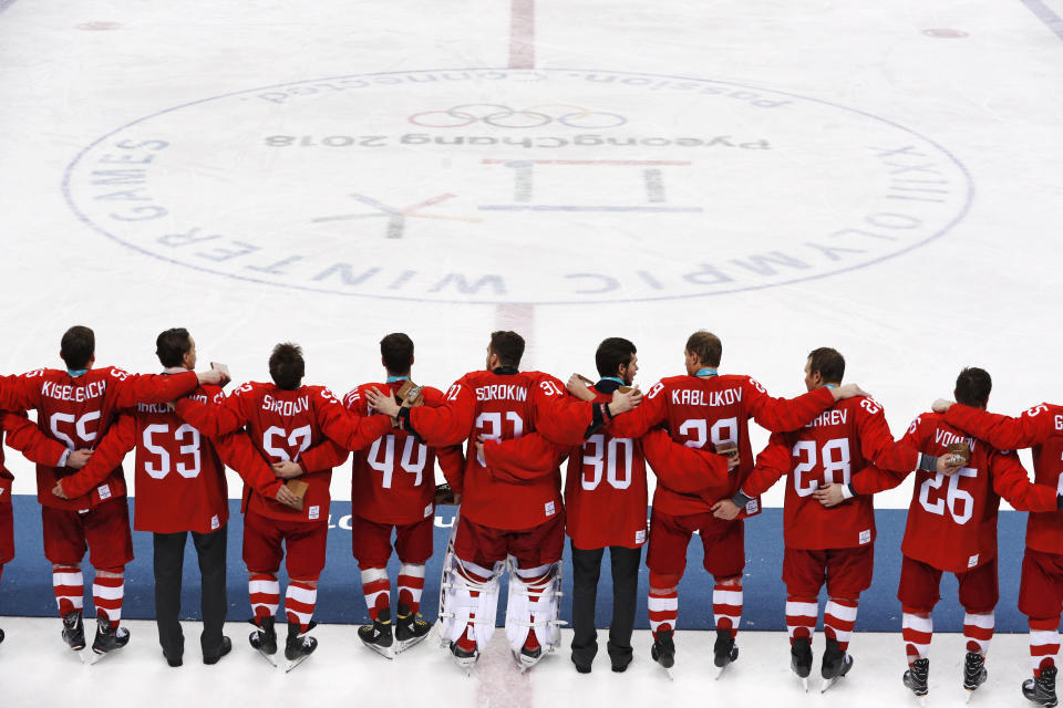 Russian hockey players sang their national anthem after winning the gold medal game over Germany. (AP)