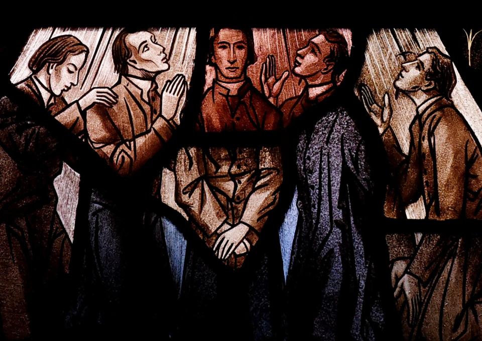 All of the five priests who died from yellow fever are depicted together in a section of the stained glass window at Holy Trinity Catholic Church.