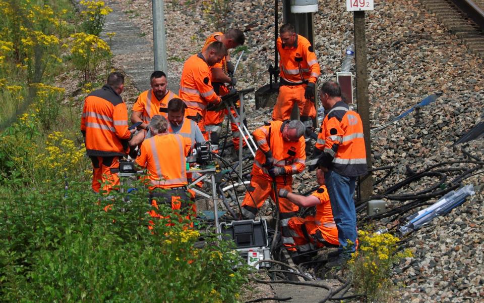 SNCF rail workers work at one of the target locations along the network