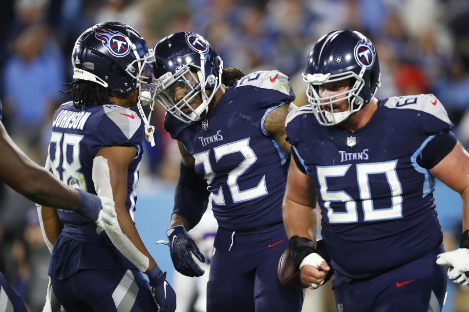 Tennessee Titans running back Derrick Henry (22) celebrates with wide receiver Marcus Johnson (88) after Henry scored a touchdown against the Buffalo Bills in the second half of an NFL football game Monday, Oct. 18, 2021, in Nashville, Tenn. (AP Photo/Wade Payne)