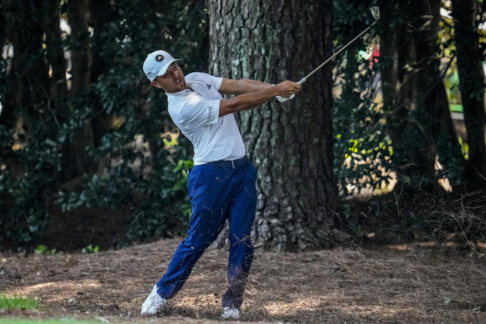 Xander Schauffele hits from the pine straw on the seventh hole during the second round of the Tour Championship golf tournament, Friday, Aug. 25, 2023, in Atlanta. (AP Photo/Mike Stewart)