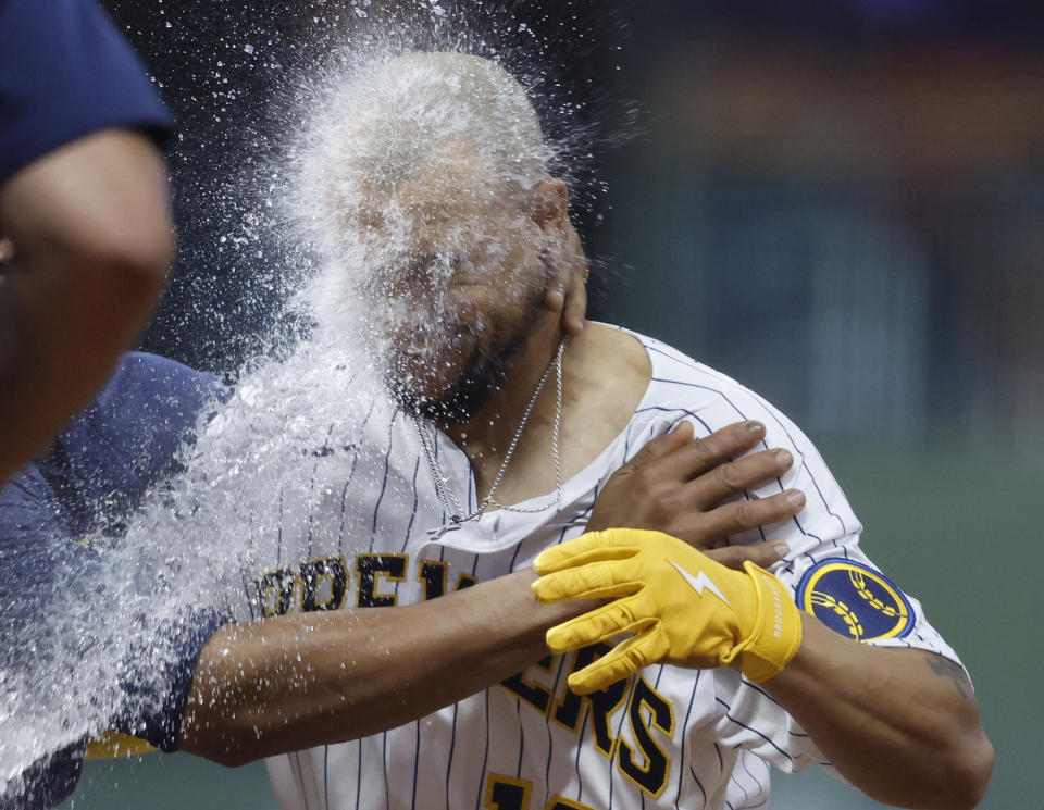 Milwaukee Brewers' Blake Perkins is is doused after he hit a winning single against the Pittsburgh Pirates during the 10th inning of a baseball game Saturday, Aug 5, 2023, in Milwaukee. (AP Photo/Jeffrey Phelps)