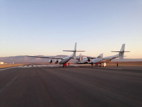 WhiteKnightTwo carries SpaceShipOne on the runway before a test flight, April 29, 2013, in Mohave, CA.