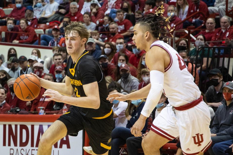 Dec 22, 2021; Bloomington, Indiana, USA; Northern Kentucky Norse guard Sam Vinson (2) dribbles the ball while Indiana Hoosiers guard Parker Stewart (45) defends in the second half at Simon Skjodt Assembly Hall.