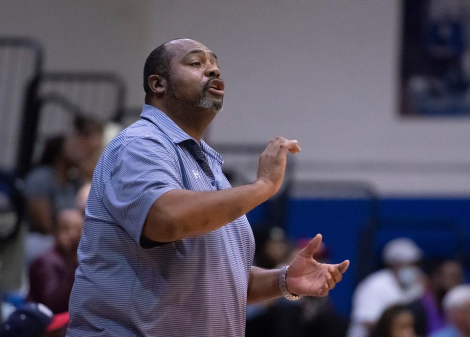 Wildcats head coach Dwayne Louis gives instructions to his players during the Tate vs Washington boys basketball game at Booker T. Washington High School in Pensacola on Thursday, Dec. 9, 2021.  The Wildcats ultimately defeated the Aggies 70-54.