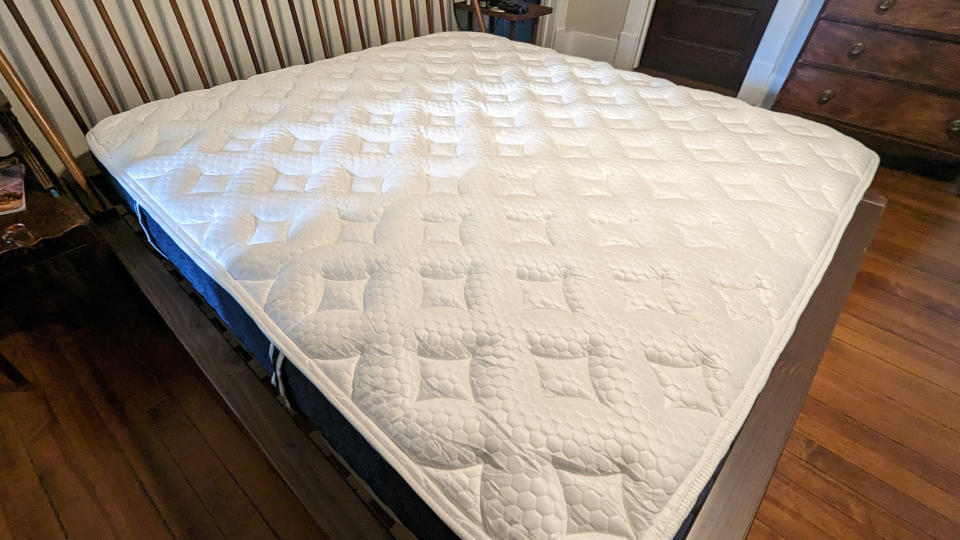 Brooklyn Bedding Signature Hybrid mattress with Cloud Pillow Top on a bed frame in reviewer's room