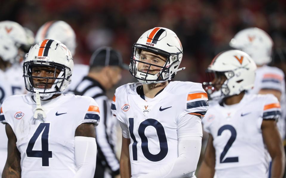 Virginia's QB Anthony Colandrea (10) reacted to being sacked by U of L during their game at the L&N Stadium in Louisville, Ky. on Nov. 9, 2023.