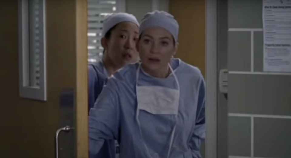 Drs Grey and Yang on Grey's Anatomy looking concerned in a doorway