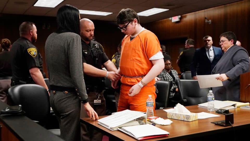 Ethan Crumbly is escorted by sheriff deputies after being sentenced Friday, December 8, 2023, in Pontiac, Michigan. - Carlos Osorio/AP