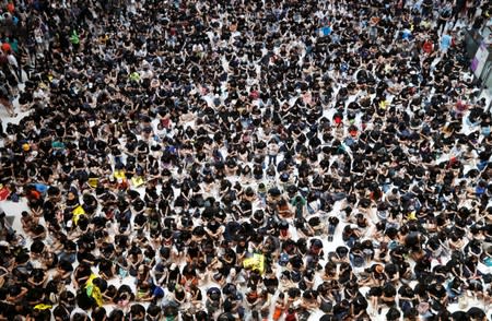 Demonstrators attend a rally to support the city-wide strike and to call for democratic reforms at New Town Plaza shopping mall in Hong Kong