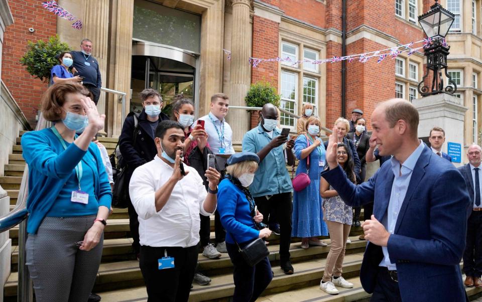 The Duke of Cambridge receives a warm send-off from staff as he leaves after visiting The Royal Marsden Hospital - AFP