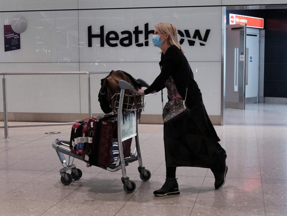 A passenger at Heathrow (PA Wire)