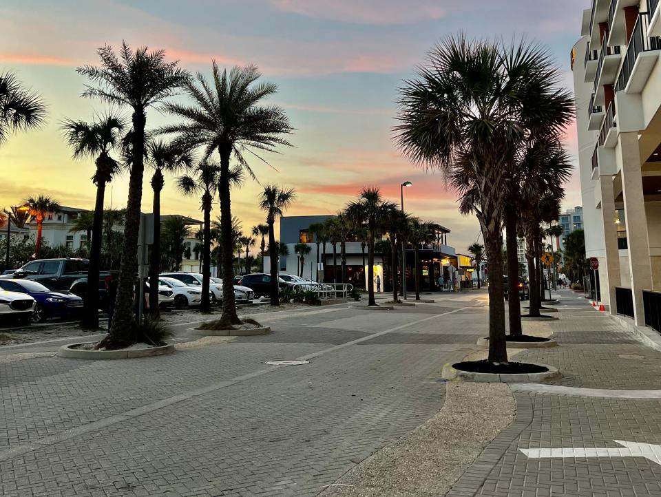 sunset over a street and parking lot in jacksonville beach florida