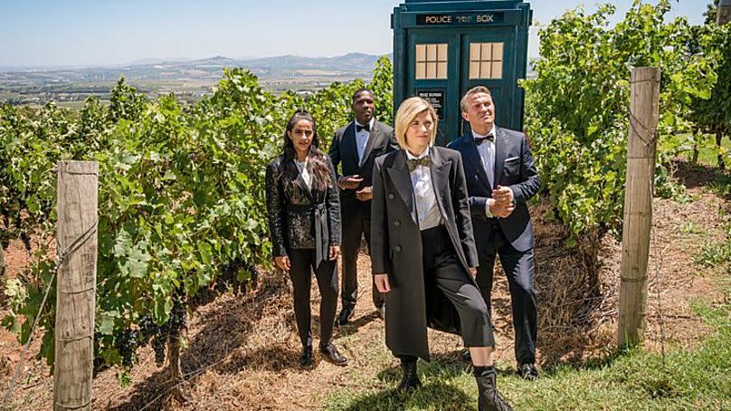 Whittaker front centre, flanked by her TARDIS team