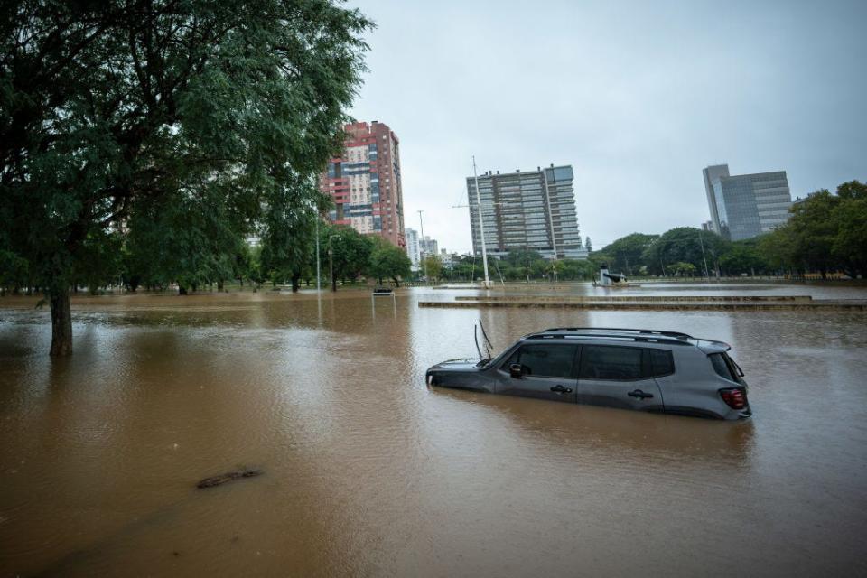 PORTO ALEGRE, BRAZIL - MAY 11: A car floats in the middle of Parque Marinha do Brasil affected by floods as rains continue to pour on May 11, 2024 in Porto Alegre, Brazil. According to the Meteorological Service, a cold front is causing new heavy rains that can exceed the 150 mm causing more damage to the city and increase in the water levels. (Photo by Jefferson Bernardes/Getty Images)
