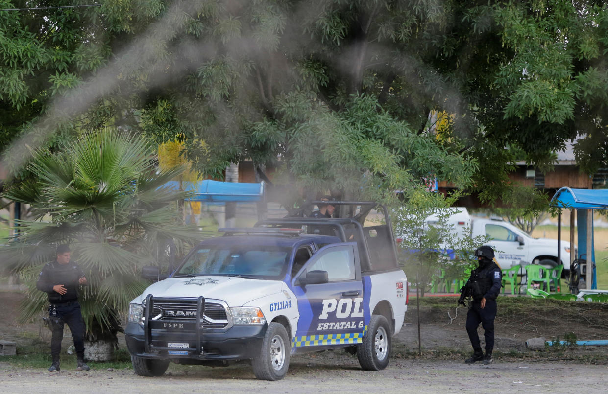 Authorities work at a crime scene where gunmen killed several people including a minor after storming a water park, in Cortazar, Guanajuato state, Mexico April 15, 2023.REUTERS/Sergio Maldonado