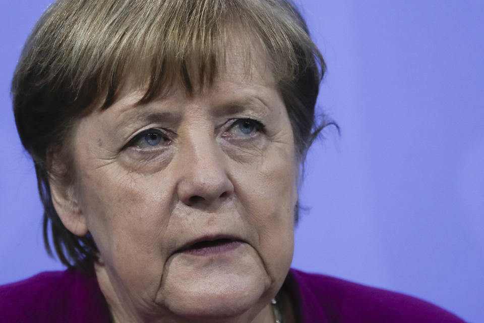 CORRECTS DAY - German Chancellor Angela Merkel attends a news conference with Bavarian state governor Markus Soeder and the Mayor of Berlin Michael Mueller after a meeting at the chancellery in Berlin, Germany, Wednesday, March 3, 2021. German Chancellor Angela Merkel conferred with the governors of the country's 16 states to discuss how to move forward with coronavirus restrictions. (AP Photo/Markus Schreiber, Pool)