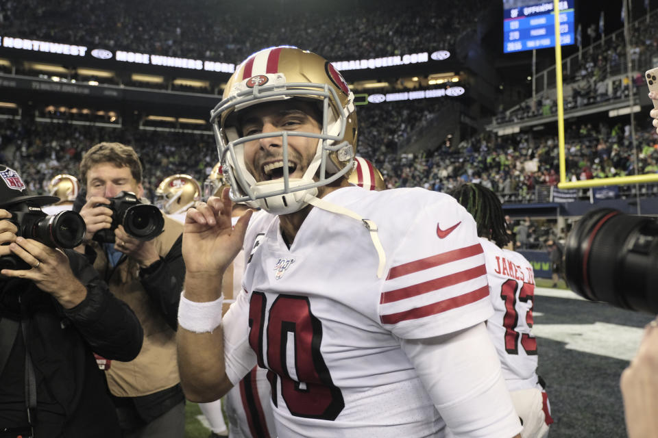 San Francisco 49ers quarterback Jimmy Garoppolo smiles after his team beat the Seattle Seahawks in an NFL football game, Sunday, Dec. 29, 2019, in Seattle. (AP Photo/Stephen Brashear)