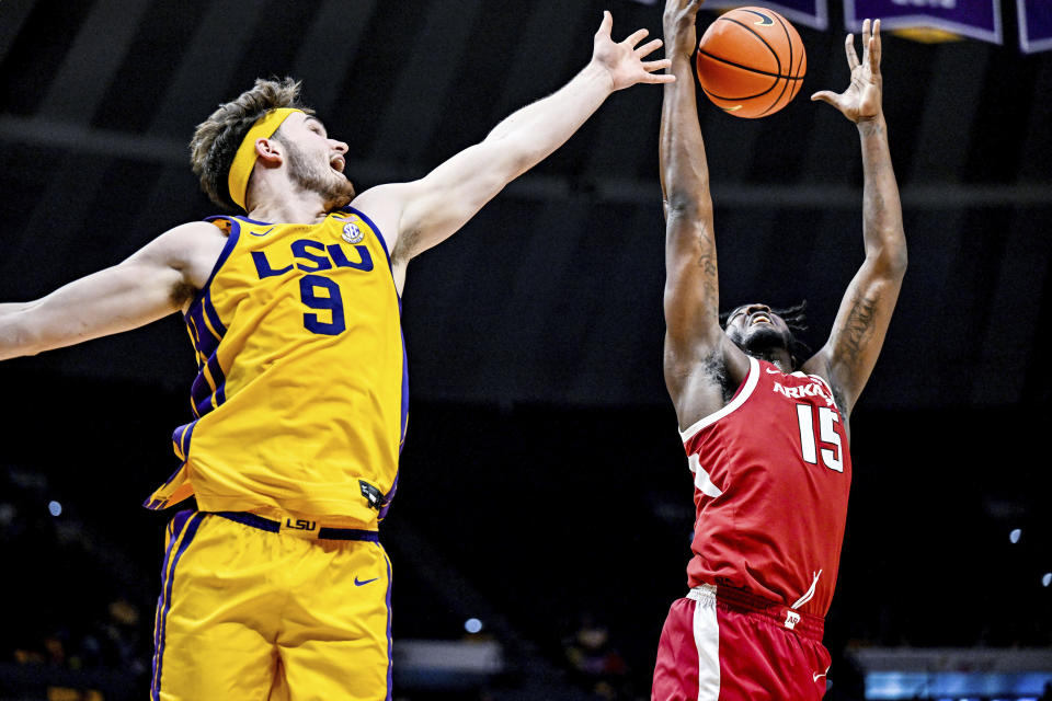 LSU forward Will Baker (9) tries to block Arkansas forward Makhi Mitchell (15) from making a rebound during an NCAA college basketball game at Pete Maravich Assembly Center, Saturday, Feb. 3, 2024, Baton Rouge, La. (Javier Gallegos/The Advocate via AP)