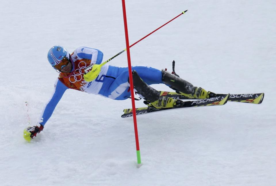 Italy's Patrick Thaler crashes in the first run of the men's alpine skiing slalom event during the 2014 Sochi Winter Olympics at the Rosa Khutor Alpine Center February 22, 2014. REUTERS/Mike Segar (RUSSIA - Tags: SPORT OLYMPICS SPORT SKIING)