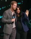 <p>Harry <a href="https://www.townandcountrymag.com/society/tradition/a26710388/meghan-markle-surprise-appearance-prince-harry-we-day/" rel="nofollow noopener" target="_blank" data-ylk="slk:brought his wife;elm:context_link;itc:0;sec:content-canvas" class="link ">brought his wife</a> on stage as he finished his address, and the couple leaned in for a cute hugging moment. </p>