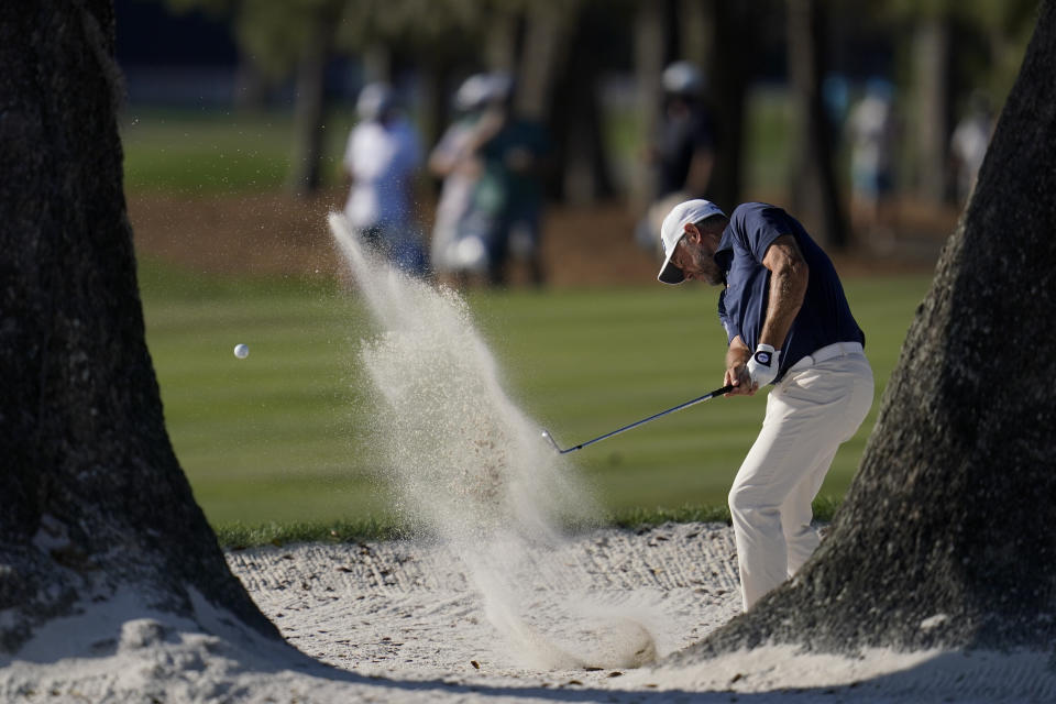 Lee Westwood, of England, hits from the bunker on the 16th hole during the final round of The Players Championship golf tournament Sunday, March 14, 2021, in Ponte Vedra Beach, Fla. (AP Photo/Gerald Herbert)