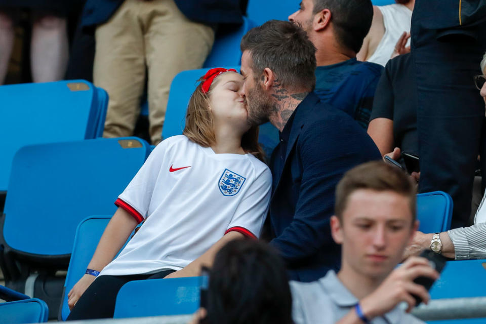 It isn't the first time David Beckham has been photographed kissing Harper on the lips, pictured here in June 2019. (Getty Images)