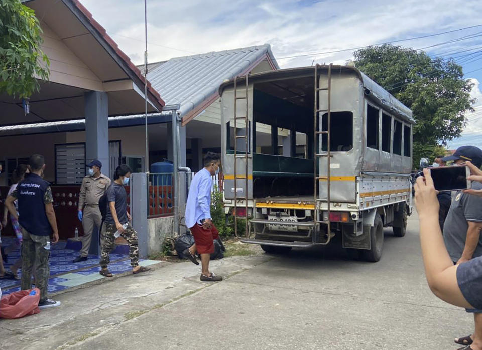 In this photo released by the San Sai District Administrative Office, journalists working for Democratic Voice of Burma, prepare to get into a van after being arrested at San Sai District in Chiang Mai province north of Thailand Sunday, May 9, 2021. Three senior journalists working for the online and broadcast news agency in Myanmar who fled after the military government ordered its operations to stop have been arrested by police in northern Thailand, their editor said Monday. (San Sai District Administrative Office via AP)