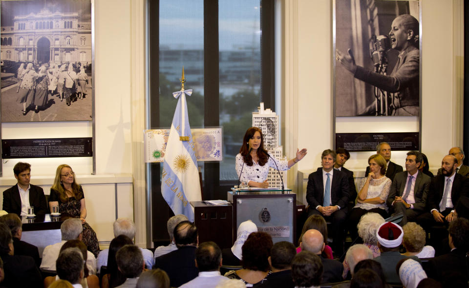 Argentina's President Cristina Fernandez talks during a ceremony at the government house in Buenos Aires, Argentina, Wednesday, Jan. 22, 2014. Fernandez spoke in public for the first time Wednesday since Dec. 10. Her 42-day silence had been feeding speculation in Argentina about her health in the wake of the head surgery she underwent in October. Some opponents have questioned who is running the country. (AP Photo/Natacha Pisarenko)