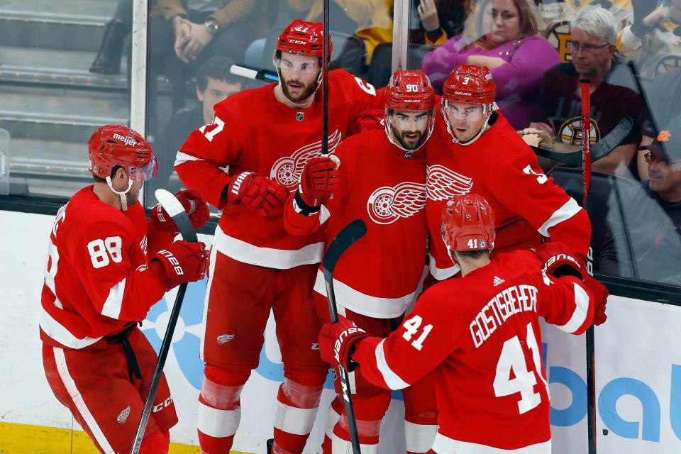 Detroit Red Wings' Joe Veleno (90) celebrates his goal against the Boston Bruins with Daniel Sprong (88), Michael Rasmussen (27), Justin Holl (3) and Shayne Gostisbehere (41) during the third period at TD Garden in Boston on Saturday, Oct. 28, 2023.