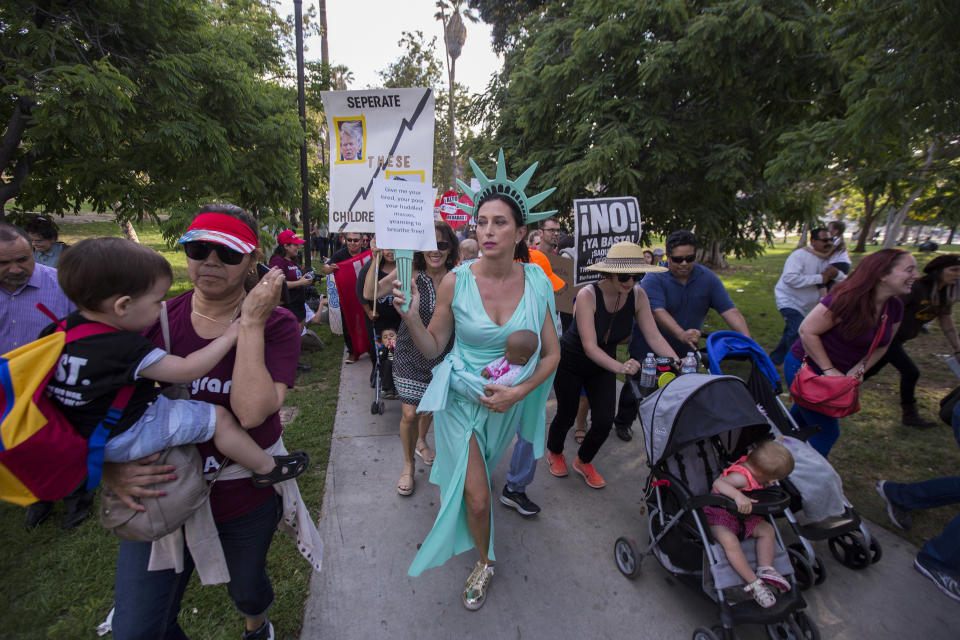 <p>People protest the Trump administration policy of removing children from parents arrested for illegally crossing the U.S.-Mexico border on June 14, 2018, in Los Angeles. Demonstrators marched through the city and culminated the march at a detention center where ICE (U.S.Immigration and Customs Enforcement) detainees are held. U.S. Immigration and Customs Enforcement recently arrested 162 undocumented immigrants during a three-day operation in Los Angeles and surrounding areas. (Photo: David McNew/Getty Images) </p>