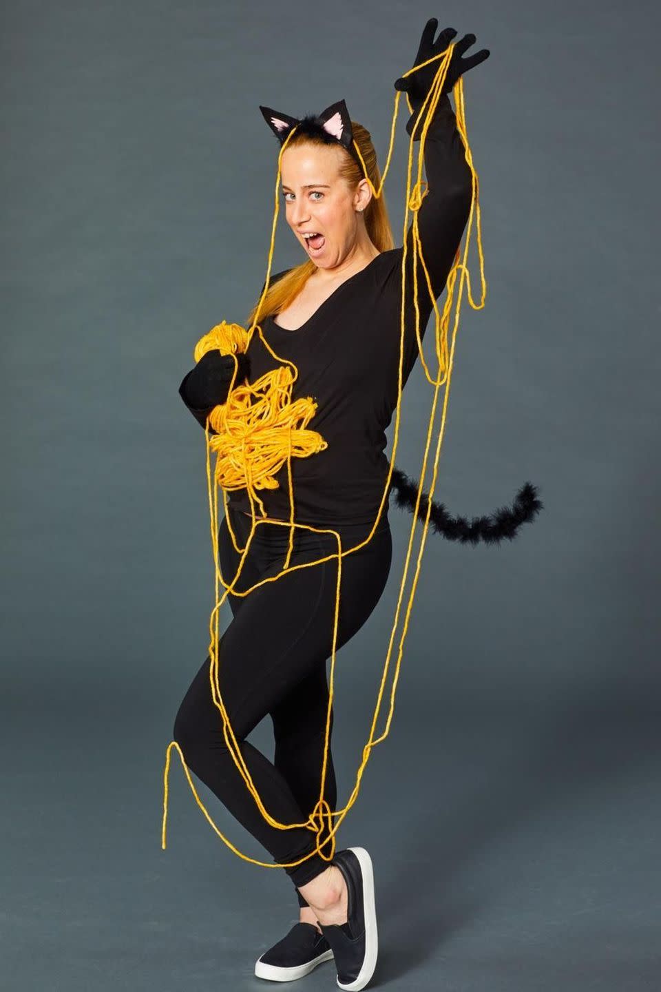 <p>Classic cat costumes are cute and all, but this pregnant-friendly one plays up your furry friend's spirited personality. To make, loop yellow yarn until you achieve a perfectly tangled mess and attach it to a black shirt, leaving a few strands free to give you something to chase. </p><p><a class="link " href="https://www.amazon.com/Black-Cat-Costume-Kids-Adult/dp/B07D6YMWM3/?tag=syn-yahoo-20&ascsubtag=%5Bartid%7C10055.g.2750%5Bsrc%7Cyahoo-us" rel="nofollow noopener" target="_blank" data-ylk="slk:SHOP CAT EARS AND TAIL;elm:context_link;itc:0;sec:content-canvas">SHOP CAT EARS AND TAIL</a></p><p><strong>RELATED:</strong> <a href="https://www.goodhousekeeping.com/holidays/halloween-ideas/g3836/homemade-pregnant-halloween-costumes/" rel="nofollow noopener" target="_blank" data-ylk="slk:The Best Pregnancy Halloween Costumes to DIY;elm:context_link;itc:0;sec:content-canvas" class="link ">The Best Pregnancy Halloween Costumes to DIY </a></p>