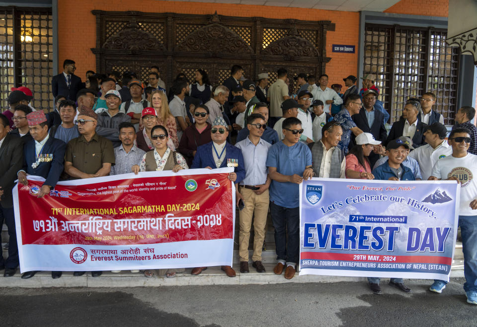 People from the mountaineering community gather to participate a rally to mark the anniversary of the first ascent of Mount Everest in Kathmandu, Nepal, Wednesday, May 29, 2024. (AP Photo/Niranjan Shrestha)