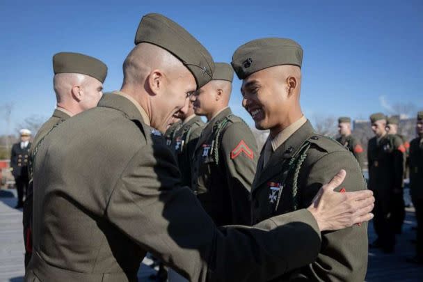 PHOTO: U.S. Marines with 1st Battalion, 8th Marine Regiment, receive a certificate during a naturalization ceremony aboard the Battleship USS North Carolina Dec. 2, 2022. (U.S. Marine Corps photo by Lance Cpl. Noah Seal)