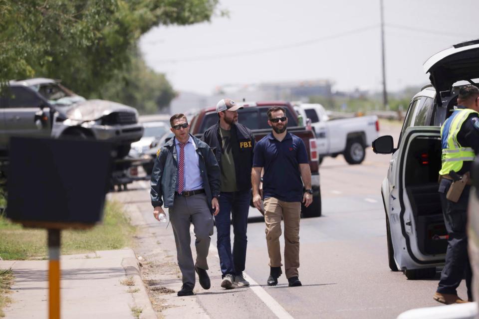 Emergency personnel respond to a fatal collision in Brownsville, Texas, on Sunday, May 7, 2023. Several migrants were killed after they were struck by a vehicle while waiting at a bus stop near Ozanam Center, a migrant and homeless shelter. 