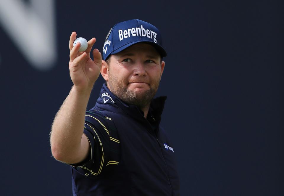 Branden Grace salutes the crowd after his 62