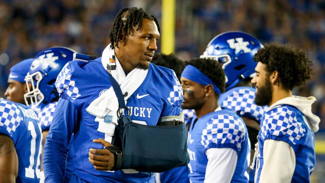 Injured Kentucky linebacker J.J. Weaver watched Saturday night’s game against Northern Illinois from the sideline.