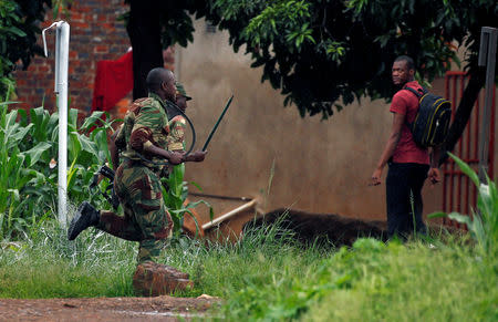 Soldiers disperse protesters in Harare, Zimbabwe, January 15, 2019. REUTERS/Philimon Bulawayo