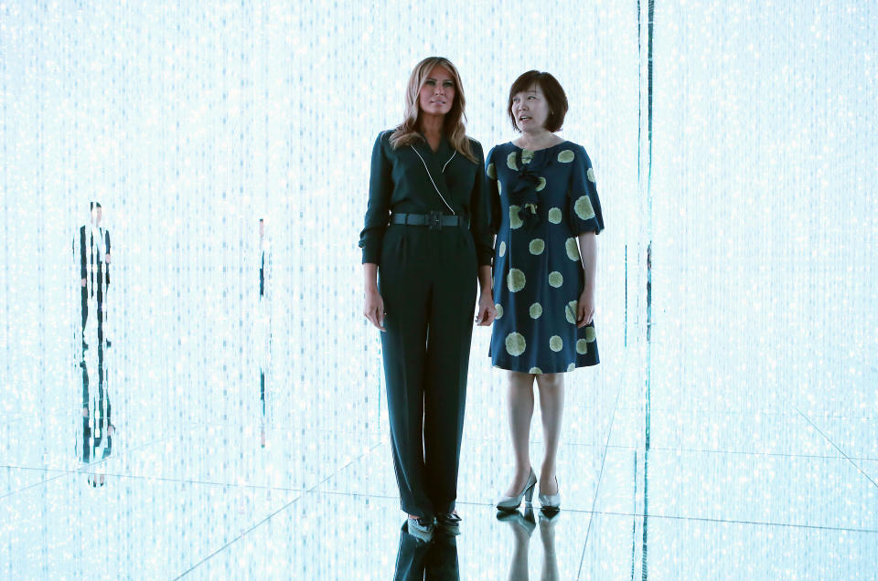 U.S. first lady Melania Trump, left, and Japanese Prime Minister Shinzo Abe's wife Akie Abe visit a digital art museum Sunday, May 26, 2019, in Tokyo. (AP Photo/Koji Sasahara)