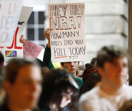 A student holds a sign addressing the National Rifle Association during a demonstration calling for safer gun laws outside the North Carolina State Capitol building six days after the shooting at Marjory Stoneman Douglas High School, in Raleigh, North Carolina, U.S., February 20, 2018. REUTERS/Jonathan Drake