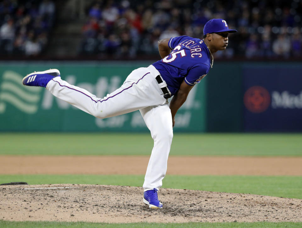 Texas Rangers closer Jose Leclerc throws to a Houston Astros batter during the ninth inning of a baseball game in Arlington, Texas, Wednesday, April 3, 2019. (AP Photo/Tony Gutierrez)