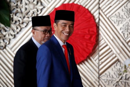 Indonesia President Joko Widodo arrives before delivering a speech ahead of Independence Day, at the parliament building in Jakarta