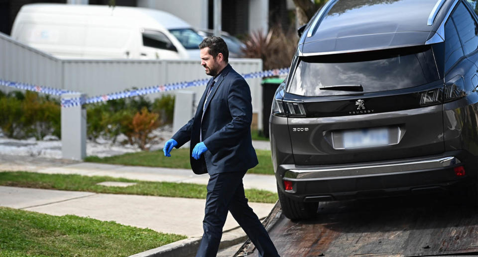Police remove vehicle from residence after fatal shooting of two women in Revesby, Sydney