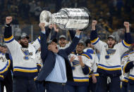 St. Louis Blues head coach Craig Berube carries the Stanley Cup after the Blues defeated the Boston Bruins in Game 7 of the NHL Stanley Cup Final, Wednesday, June 12, 2019, in Boston. (AP Photo/Michael Dwyer)